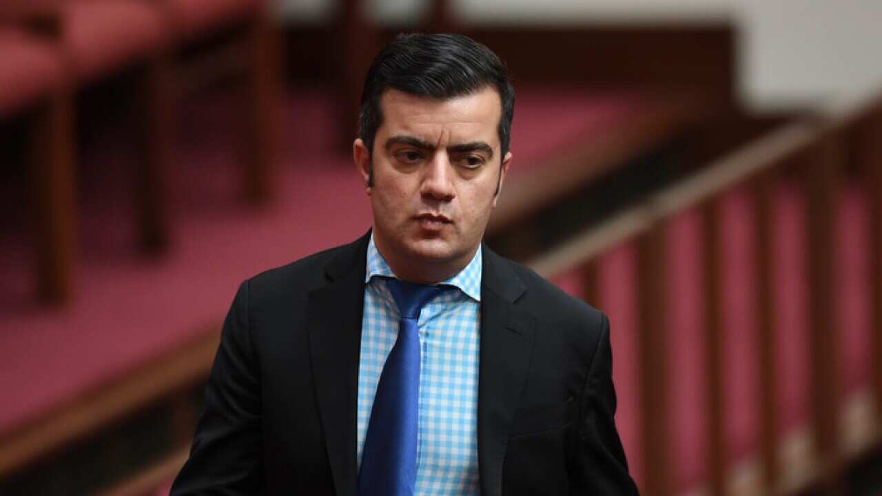 Labor Senator Sam Dastyari reacts during the Same Sex Marriage debate in the Senate chamber at Parliament House in Canberra.