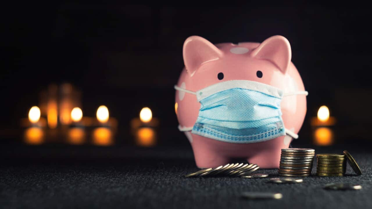 Piggy bank in a mask on a background of blurry lights -Konstantin Evdokimov-Unsplash