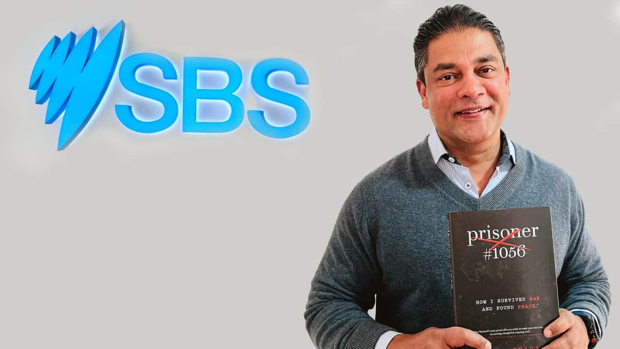 Roy Ratnavel with his first book, Prisoner #1056: How I survived War and found Peace.