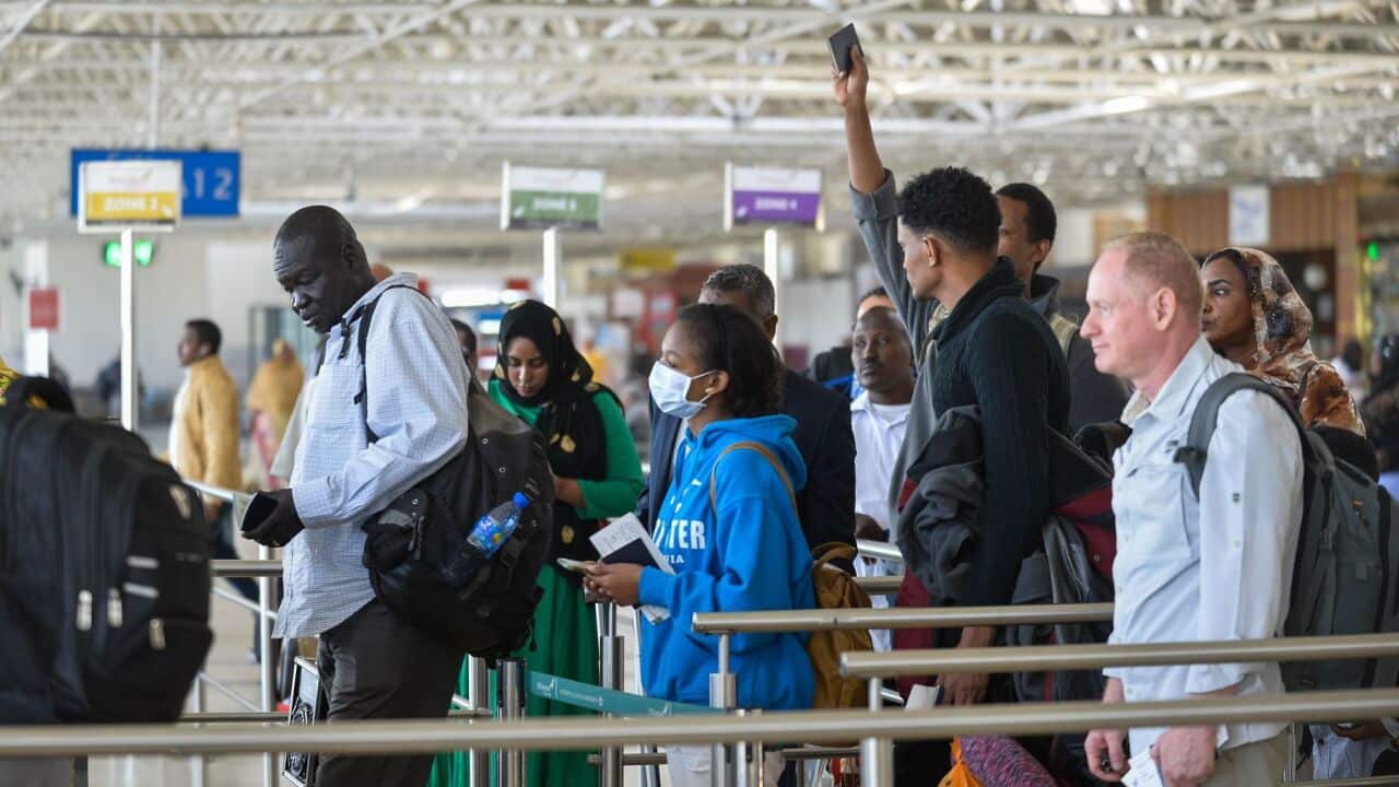 A passenger wears a mask as she waits at passport control in Bole International Airport in Addis Ababa, on January following an outbreak of coronavirus in china