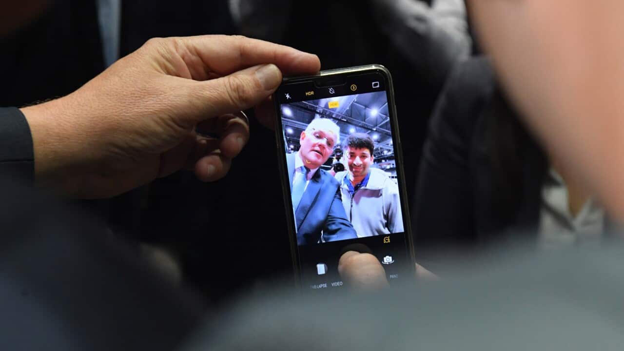 Prime Minister Scott Morrison takes a selfie at the Western Sydney Jobs Fair