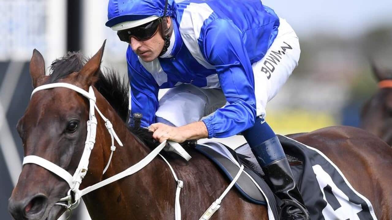 Jockey Hugh Bowman rides Winx to victory