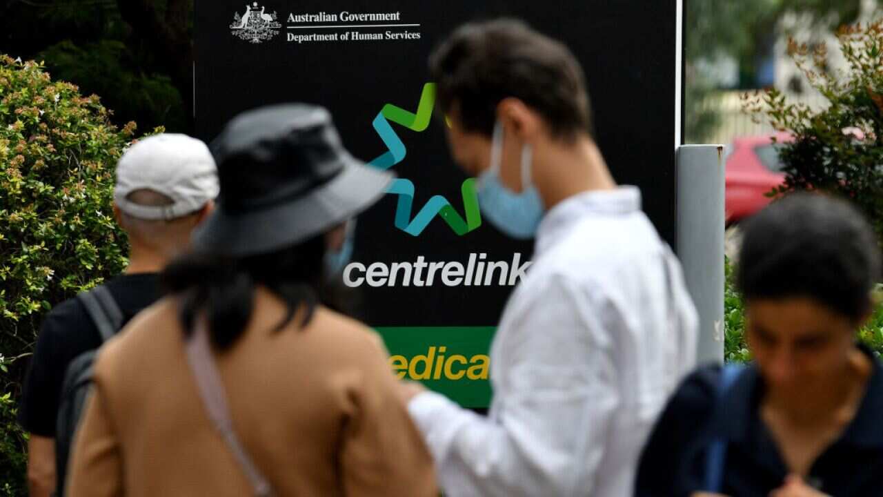People waiting outside Centrelink office