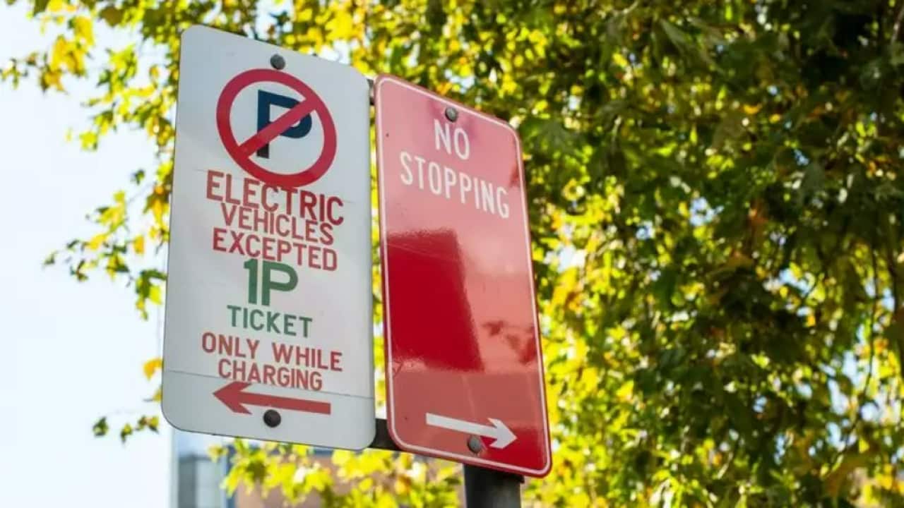 An electric vehicle parking sign is seen in Chatswood, Sydney