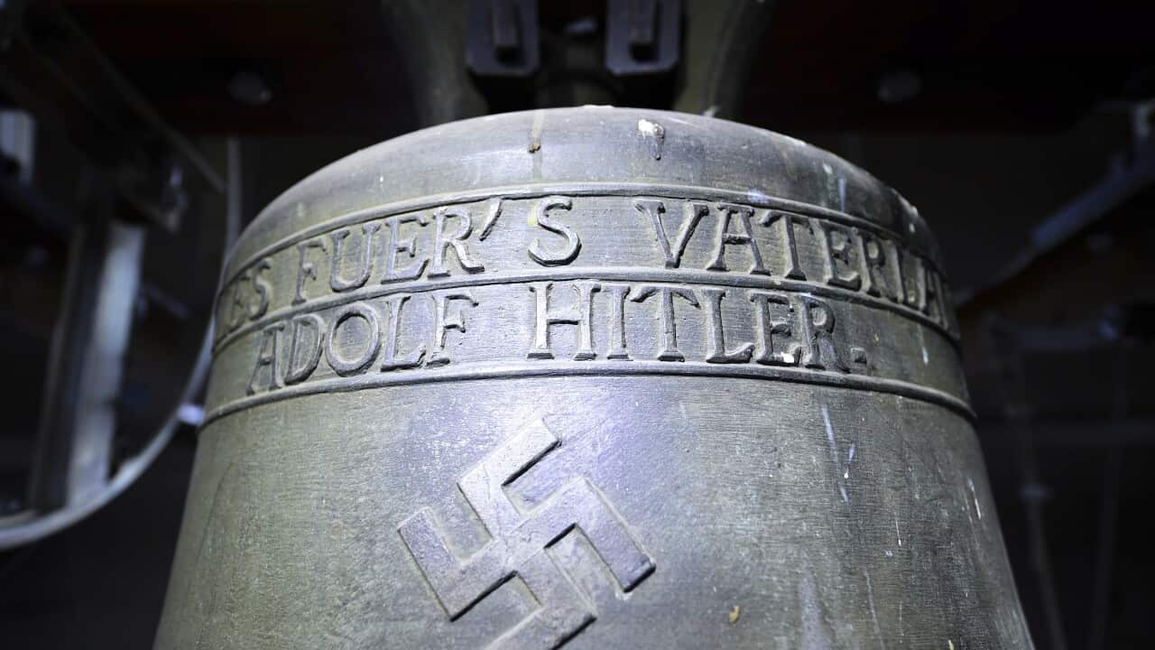 A church bell with the inscription "Everything for the fatherland Adolf Hitler" and a swastika is pictured in the town church in Herxheim am Berg, Germany.