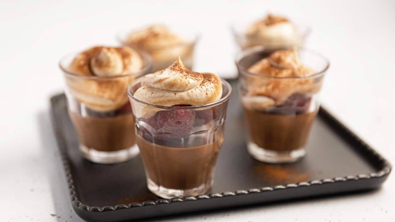 Glasses layered with chocolate, berries and a swirl of chestnut cream sit on a tray.