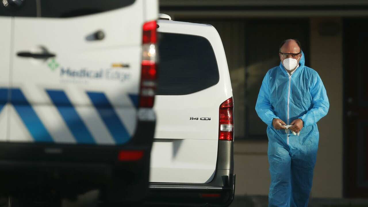 Personnel arrive to remove a body at St Basil’s Homes for the Aged in Fawkner, Melbourne, Friday, July 31, 2020. (AAP Image/Daniel Pockett) NO ARCHIVING