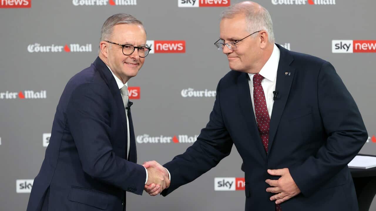 Australian Opposition Leader Anthony Albanese (left) shakes hands with Australian Prime Minister Scott Morrison during the first leaders' debate of the 2022 federal election hosted by Sky News at the Gabba in Brisbane