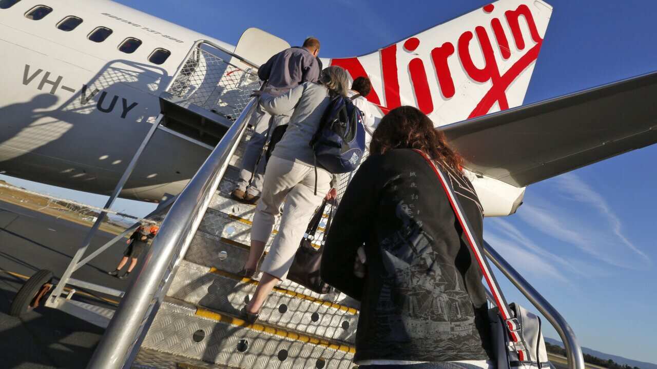 A file photo showing passengers boarding a Virgin Australia plane at Hobart International Airport, Tasmania.