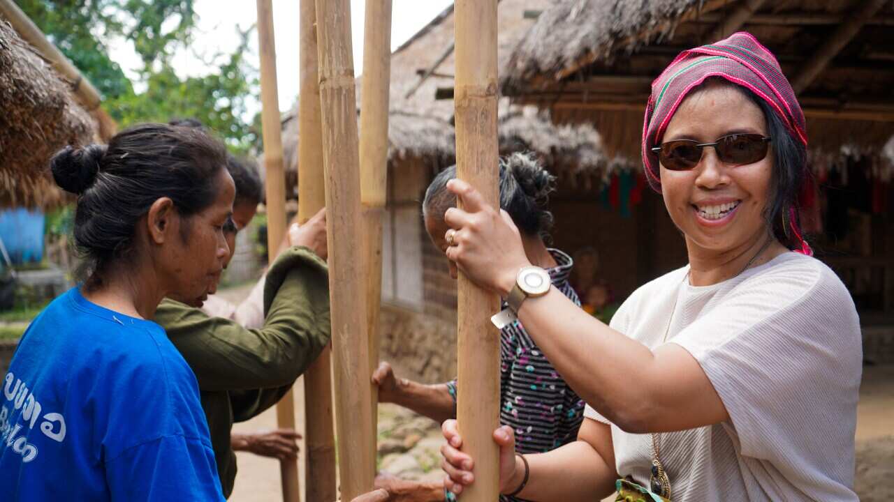 Ellis Robb learns how to pound rice in Lombok.jpg