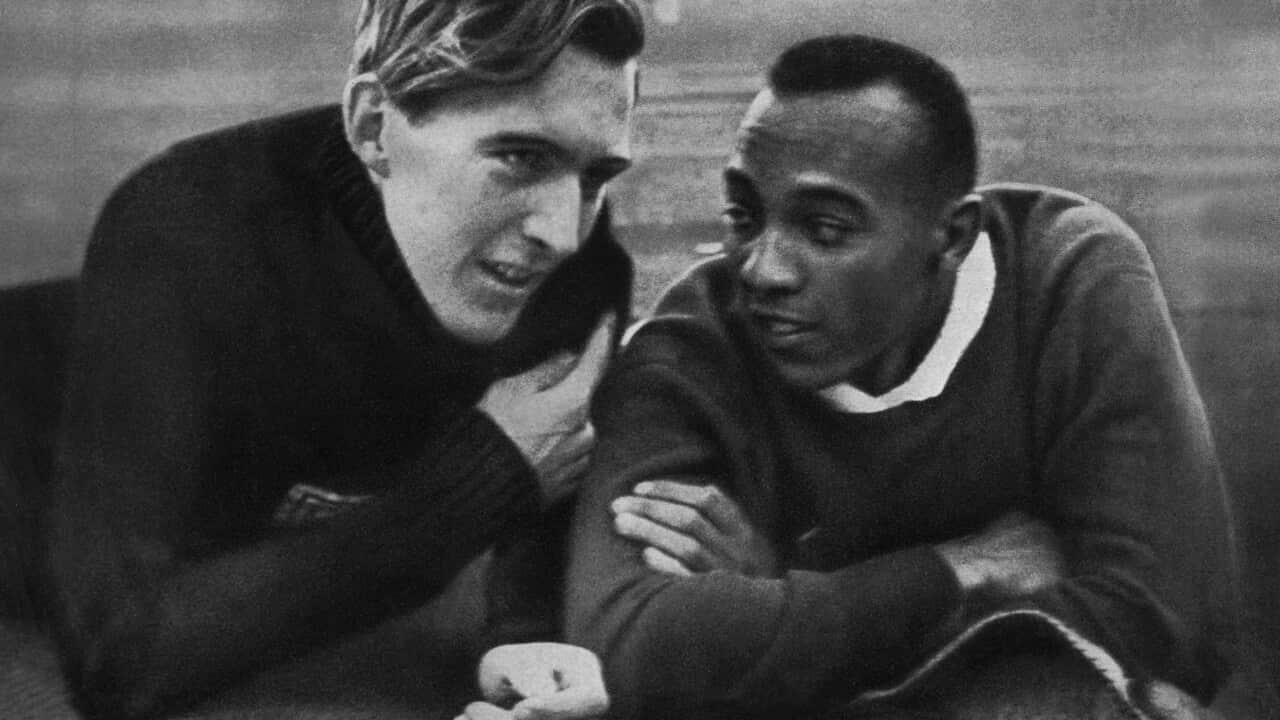 US champion Jesse Owens (R) and German c
