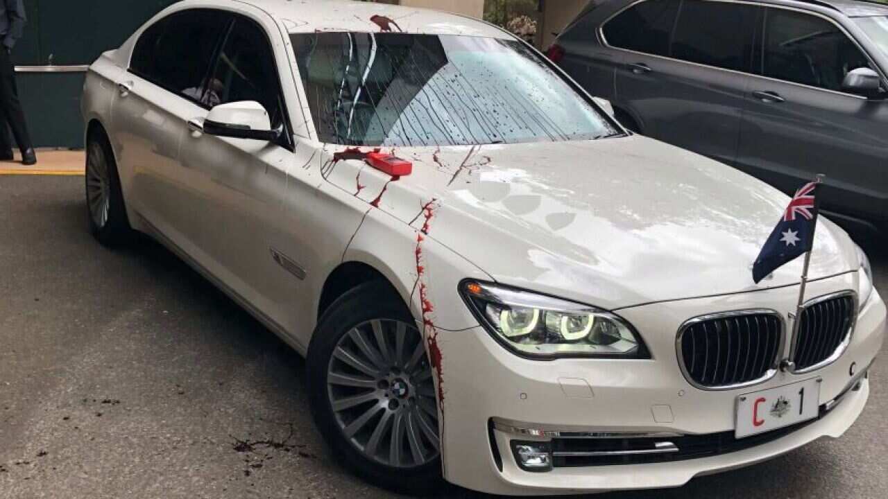 The Prime Minister's car was damaged after protesters threw red paint.