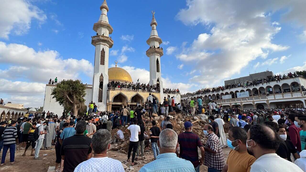 People who survived the deadly storm that hit Libya, protest against the government outside the Al Sahaba Mosque in Derna (AAP)