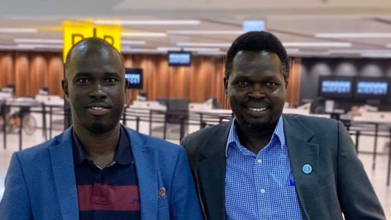 Philip Geu and his cousin at the airport