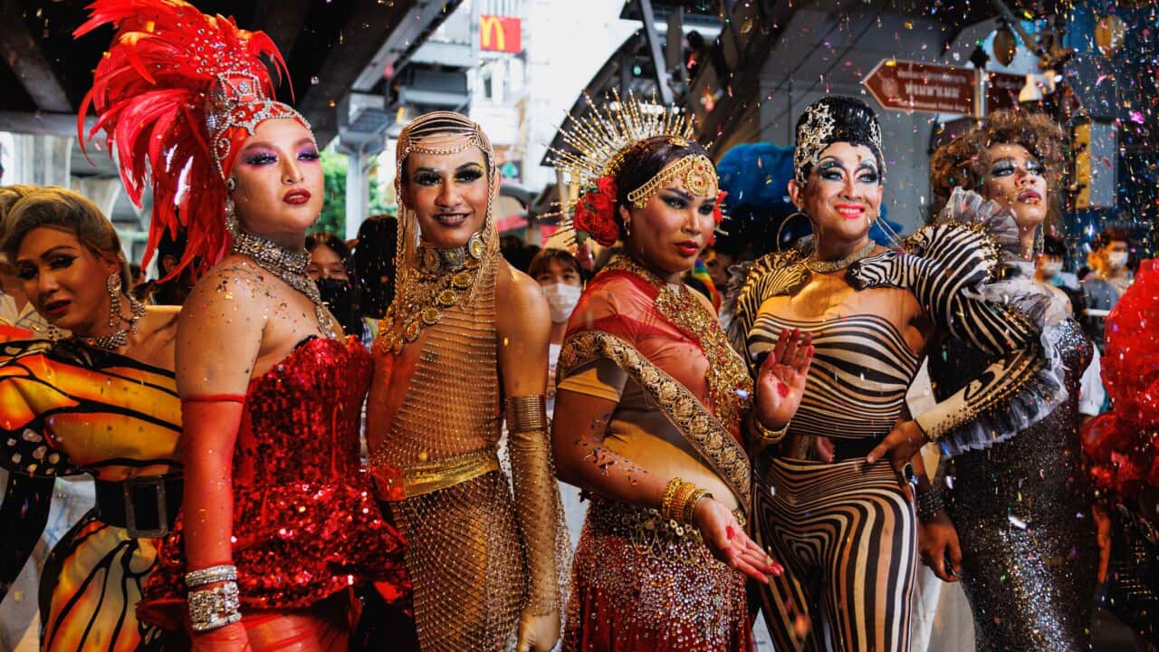 Drag queens posing for a photo.