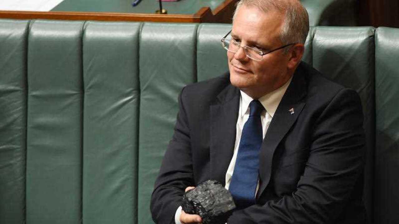 Then-Treasurer Scott Morrison with a piece of coal during House of Representatives Question Time.