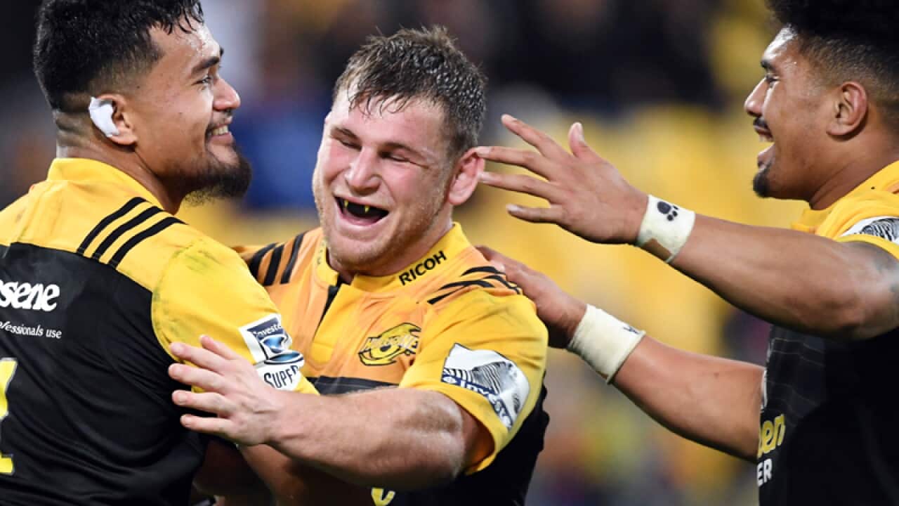 Vaea Fifita of the Hurricanes, left, celebrates his try