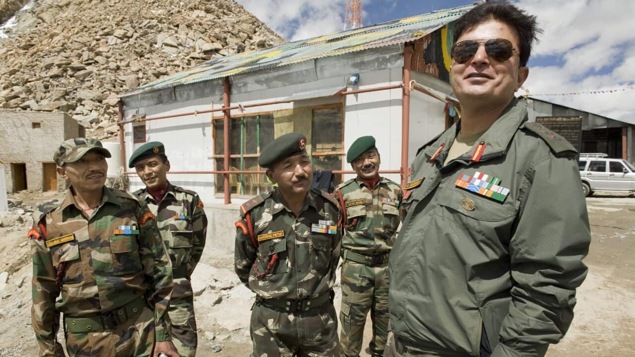 A colonel in the Indian army (far right, name withheld), stands with members of the Ladakh scouts at Khardung La, a mountain pass in the Laddakh, India.