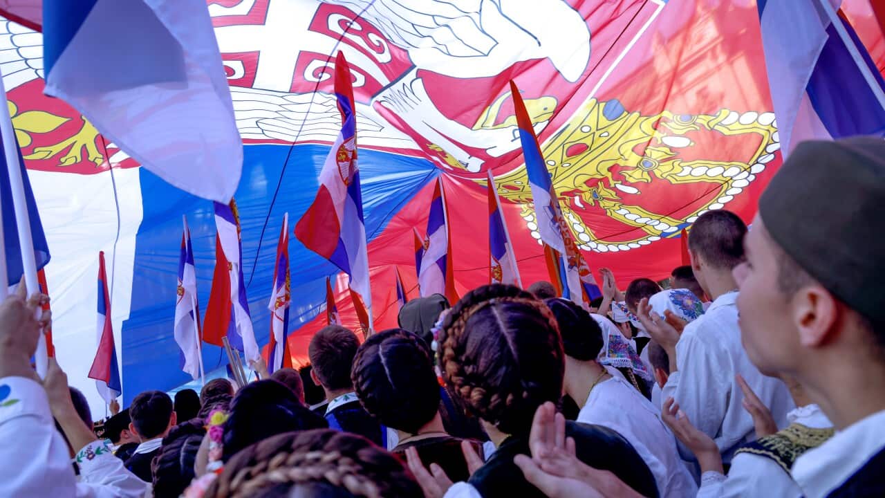 Young Serbs dressed in traditional costumes wave Serbia flags during the manifestation 'One nation, one gathering - Serbia and Srpska', in Belgrade, Serbia, 08 June 2024