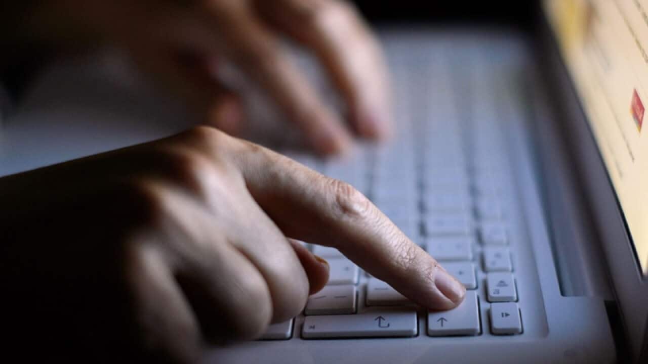 someone using a laptop keyboard