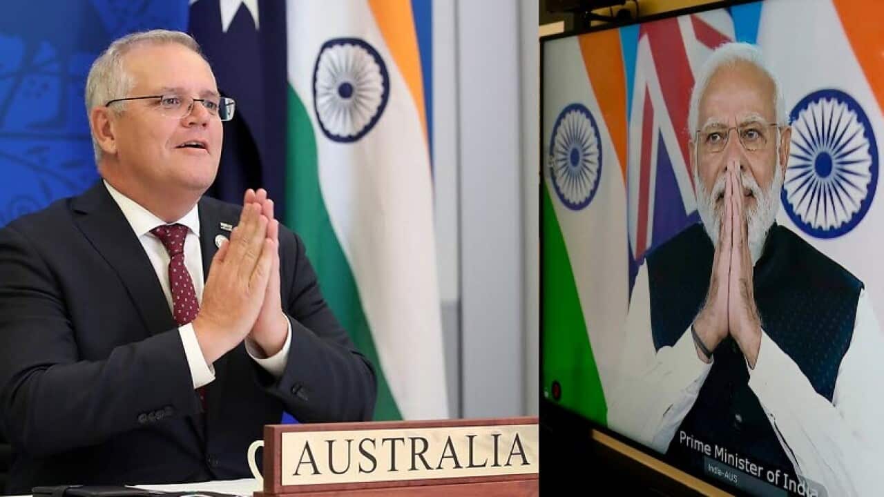 Australian Prime Minister Scott Morrison speaks with Indian Prime Minister Narendra Modi during a virtual leaders' summit in Brisbane, Monday, March 21, 2022.