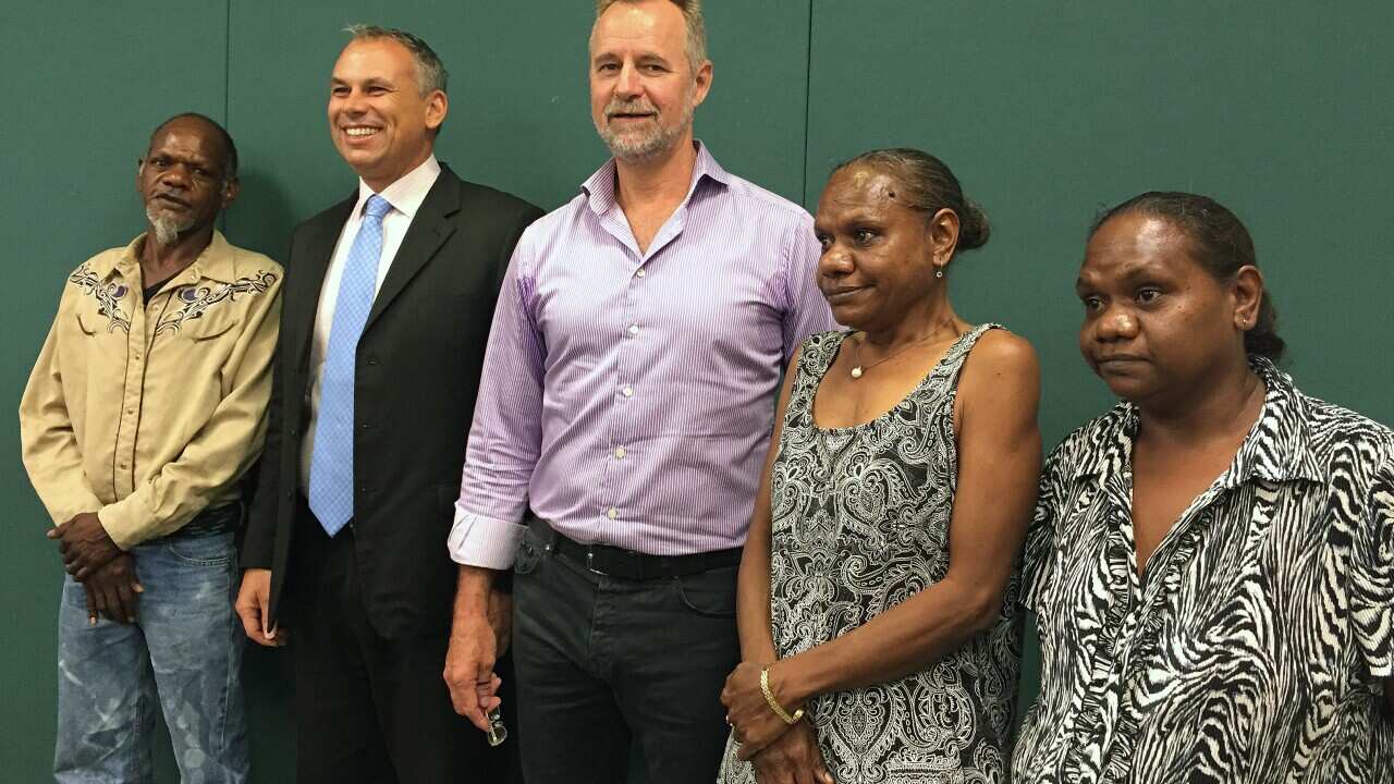 (L-R) Justin Singh, Northern Territory Chief Minister Adam Giles, Federal Indigenous Affairs Minister Nigel Scullion, Raylene Singh and Zoe Singh pose for a photograph at Parliament House in Darwin