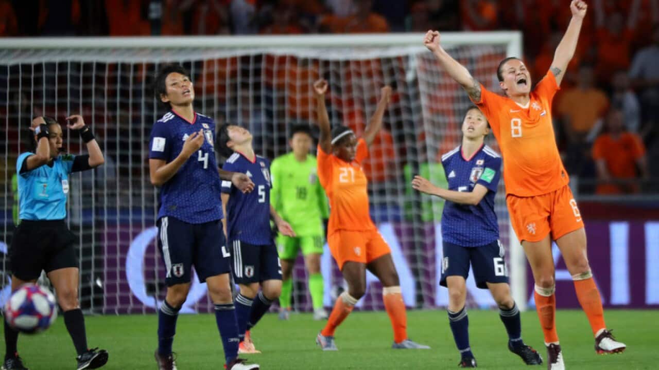 Netherlands' players celebrate after winning the FIFA Women's World Cup round of 16 match against Japan