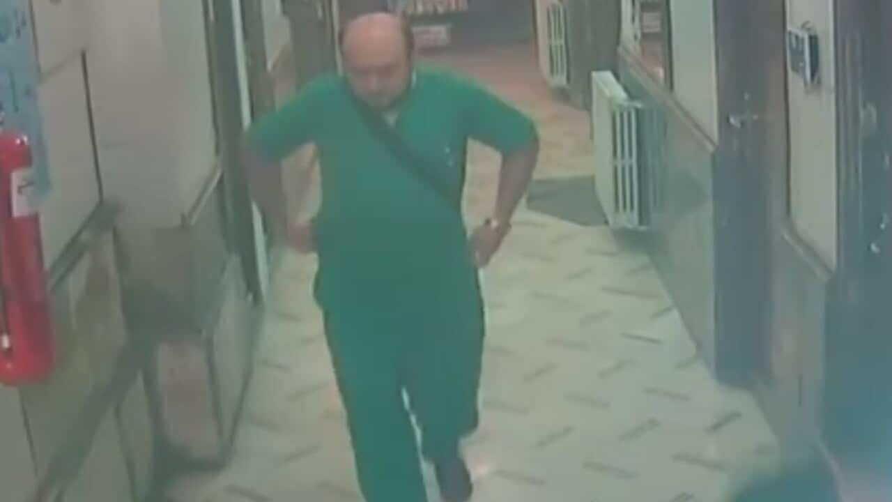 Aleppo's last paediatrician, Dr Muhhamad Maaz, pictured seconds before he was killed in a fatal airstrike.