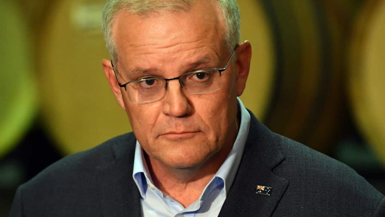 Prime Minister Scott Morrison with reporters at a winery.