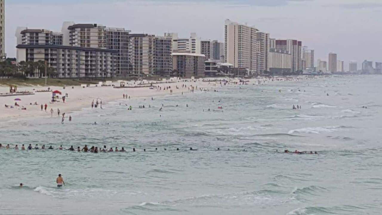 A human chain off a Florida beach
