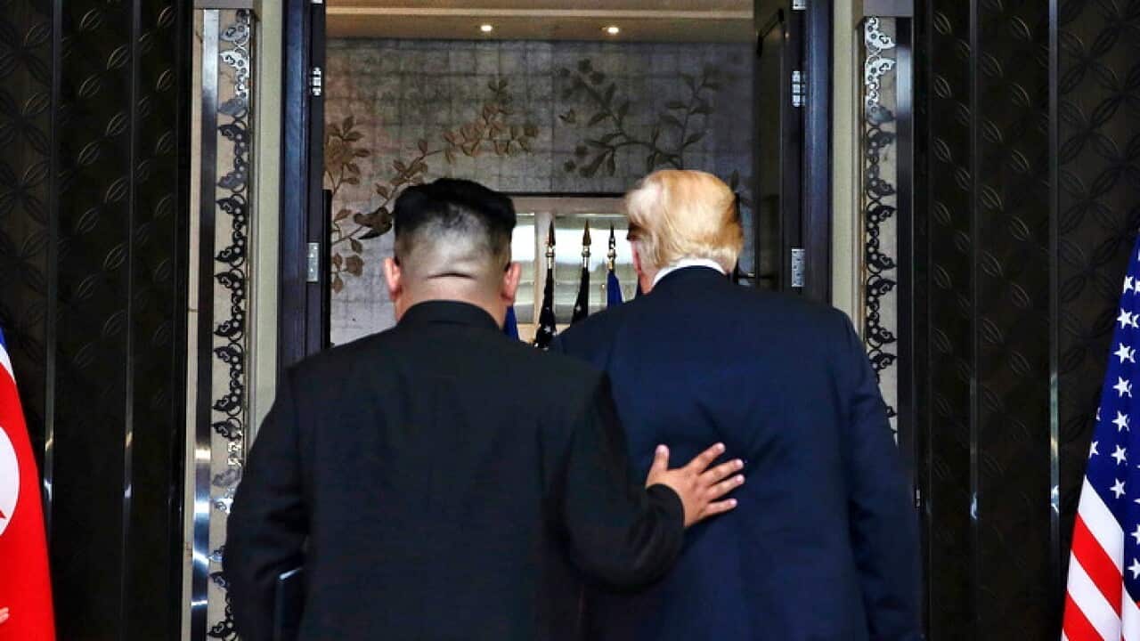 US President Donald Trump (R) and North Korean Chairman Kim Jong-un after their historic summit in Singapore