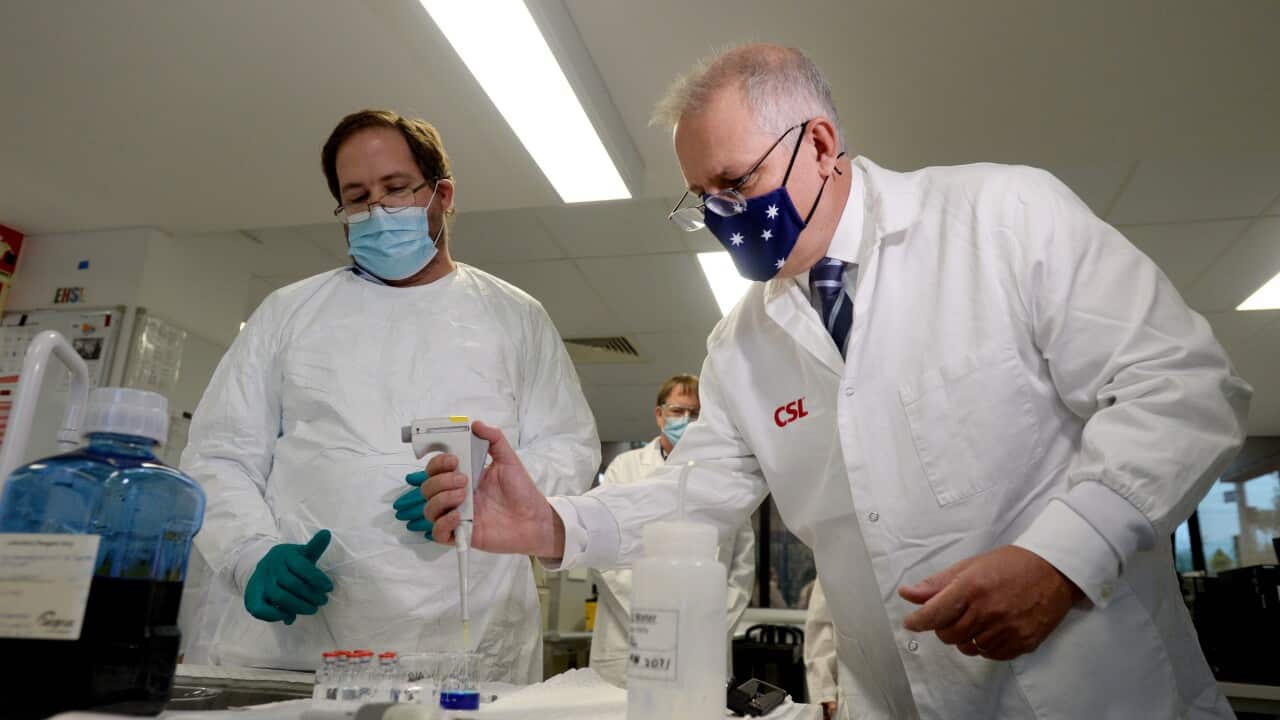 Prime Minister Scott Morrison meets CSL staff working on the COVID vaccine while he tours the company's facility in Melbourne, Friday, March 26, 2021. (AAP Image/Andrew Henshaw) NO ARCHIVING