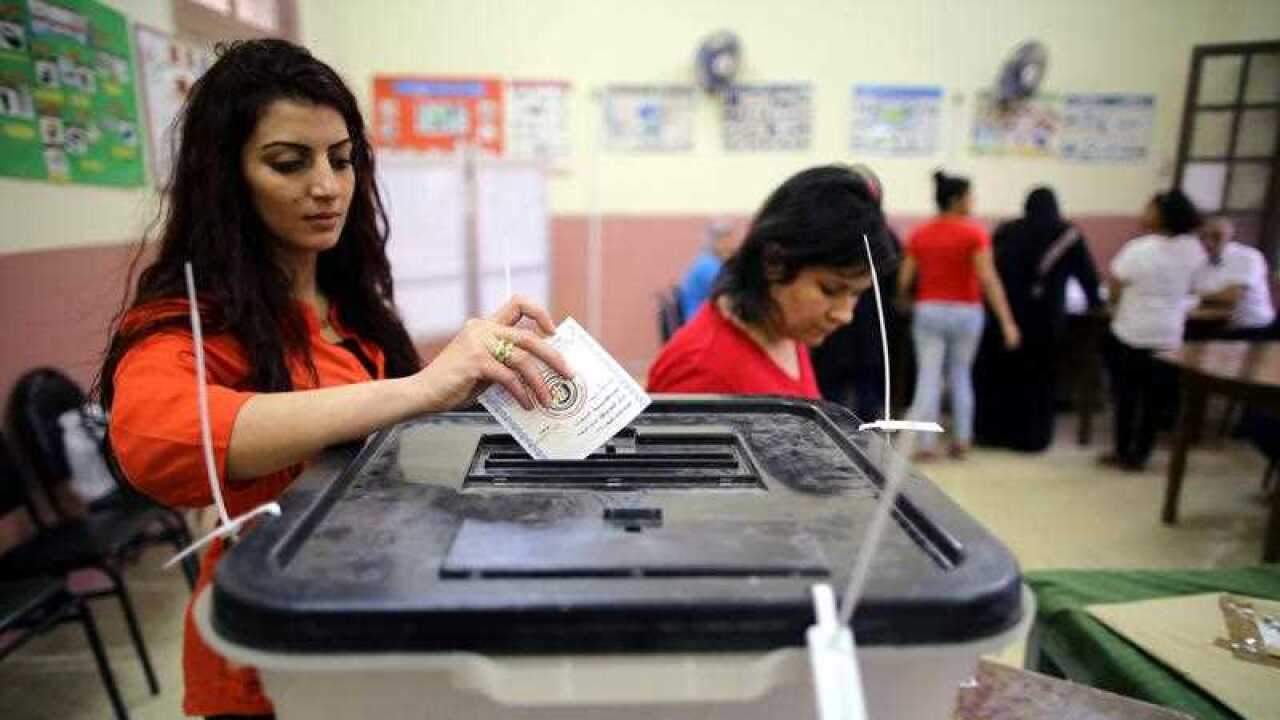 An Egyptian woman casts her ballot paper on the final day of the Egyptian presidential election in Cairo, Egypt, 28 March 2018.