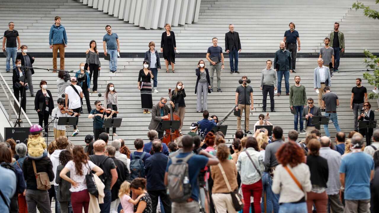 A classic orchestra performs live outside the Philharmonie in Paris as part of France's annual music festival.