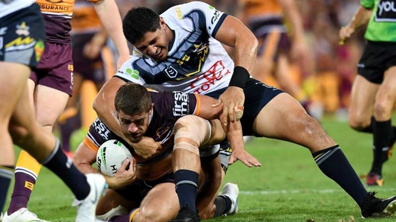 Jason Taumalolo of the Cowboys (right).