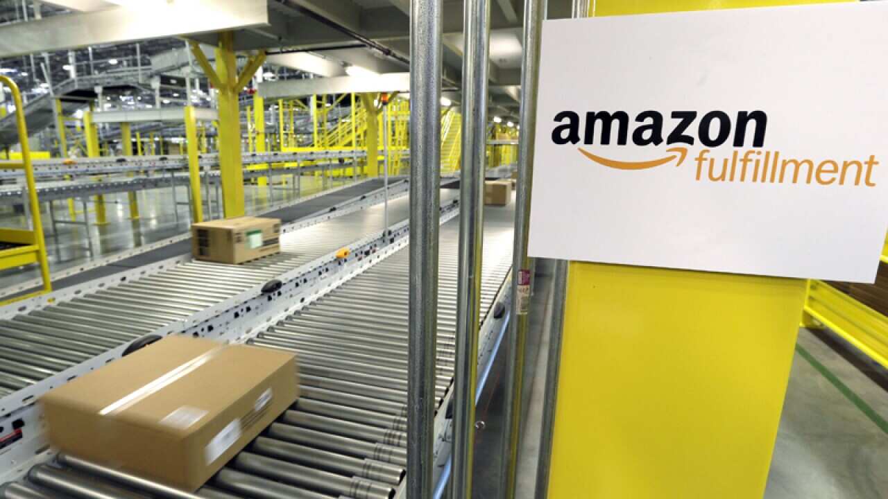 A package moves along a conveyor belt at an Amazon fulfilment centre