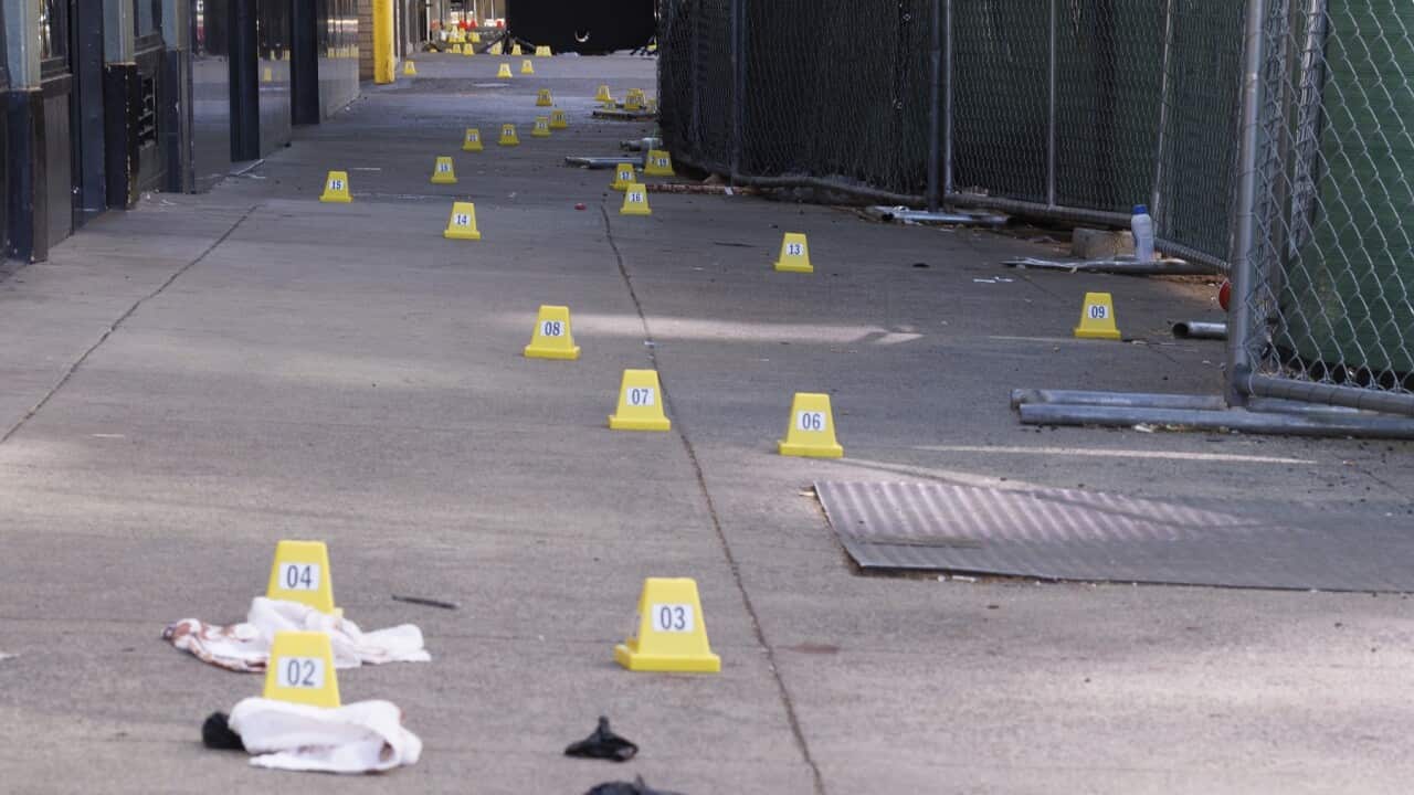 Evidence markers line the footpath after a mass shooting in Sacramento, California, US