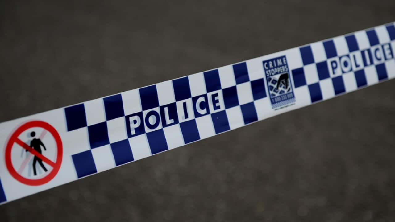 Police tape restricts access to a street in Sydney