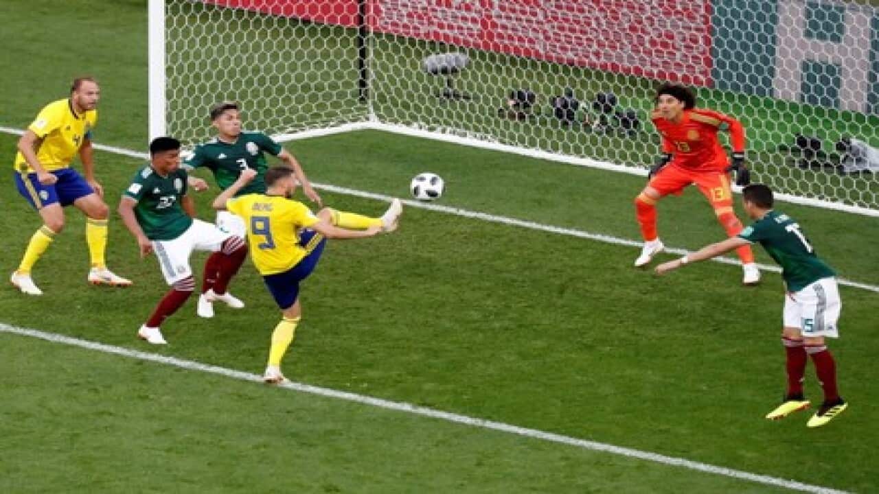 Swedes beat Mexico 3-0 but both through to last 16