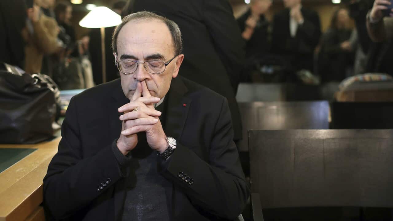 French Cardinal Philippe Barbarin waits for the start of his trial at the Lyon courthouse, central France.