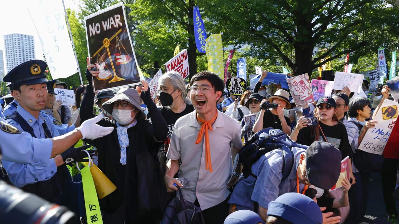 Rally opposes the government's push to revise the pacifist constitution in Japan