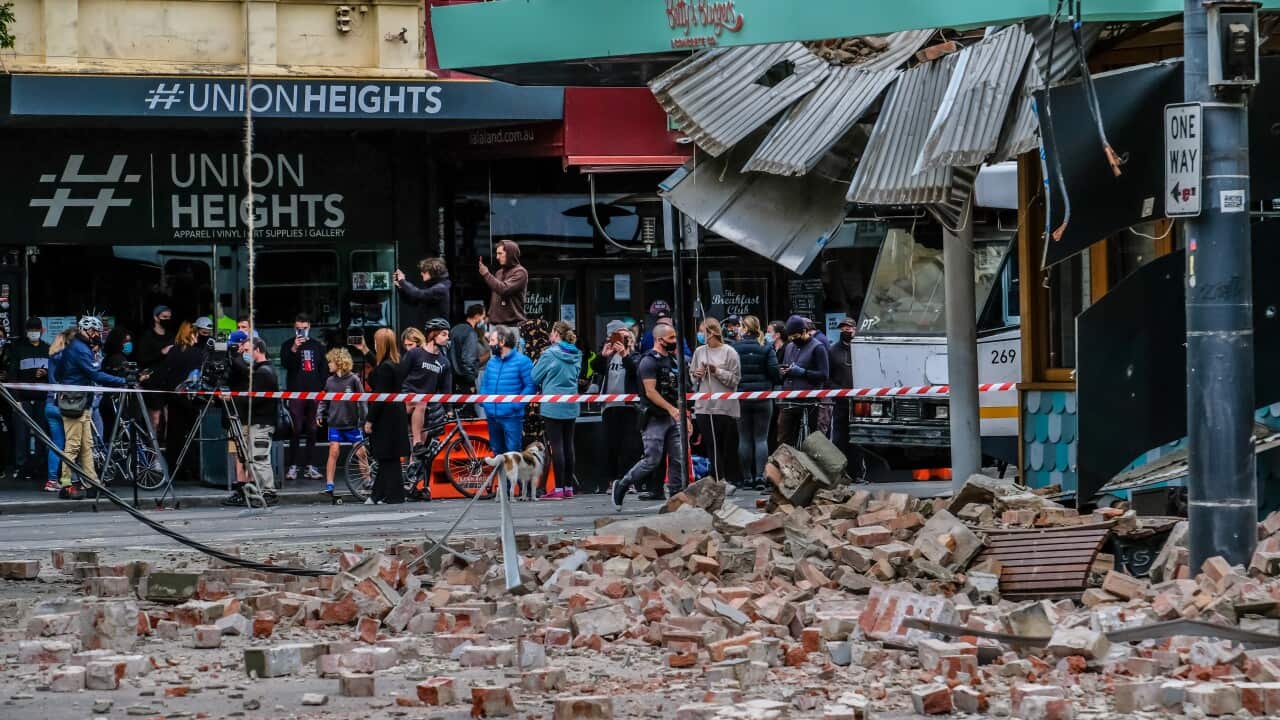 damage to chapel street shopfront with bricks on the road