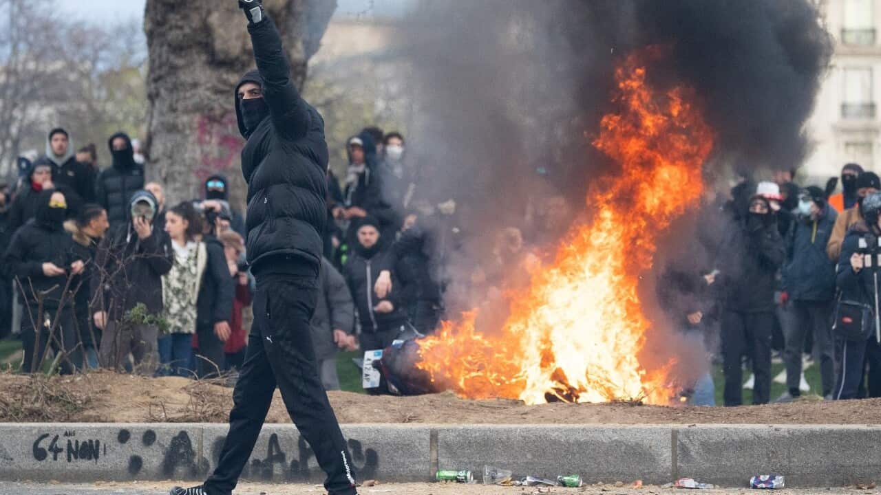 thumbnail_Protesters next to burning barricades during a demonstration in Paris after the government pushed its pension reforms through parliament without a vote. (Raphael Lafargue, ABACA.jpg