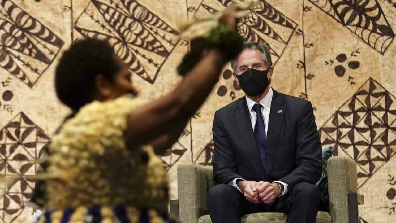 US Secretary of State Antony Blinken watches a cultural farewell ceremony in Nadi, Fiji on 12 February 2022.