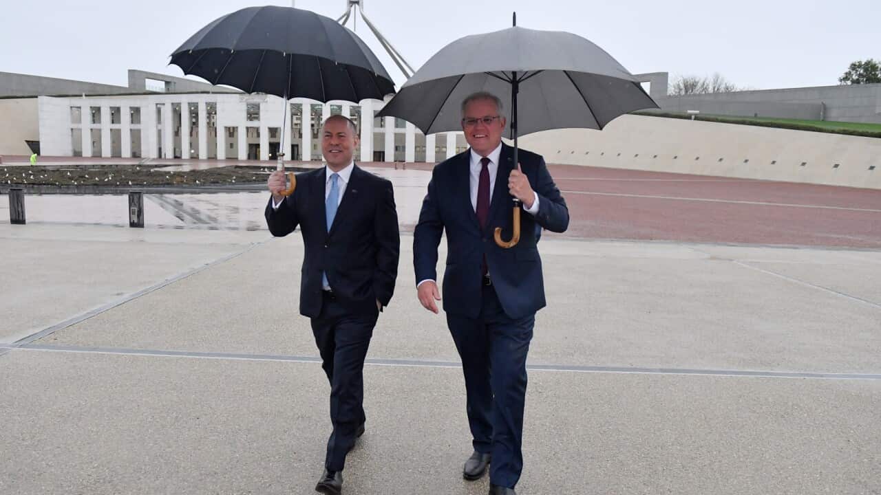 Treasurer Josh Frydenberg and Prime Minister Scott Morrison arrive to do interviews with breakfast television shows on the lawns of Parliament House in Canberra, Wednesday, October 7, 2020. (AAP Image/Mick Tsikas) NO ARCHIVING