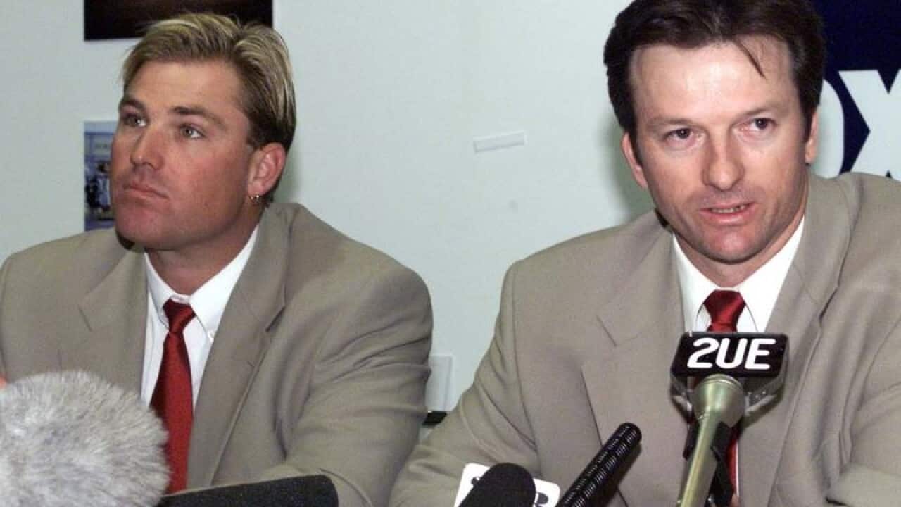 Australian cricketer Shane Warne (L) and Steve Waugh