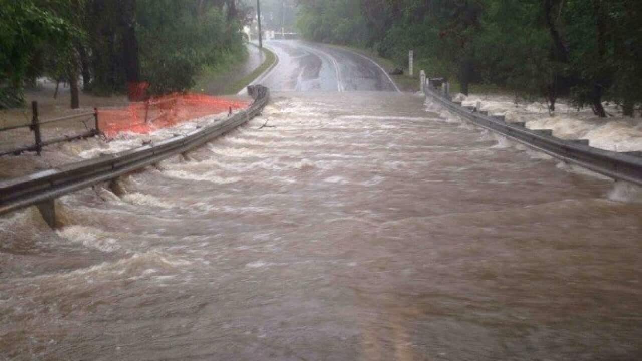 Flash flooding has been reported across the Gold Coast and parts of Brisbane, with highways and roads cut off by water.