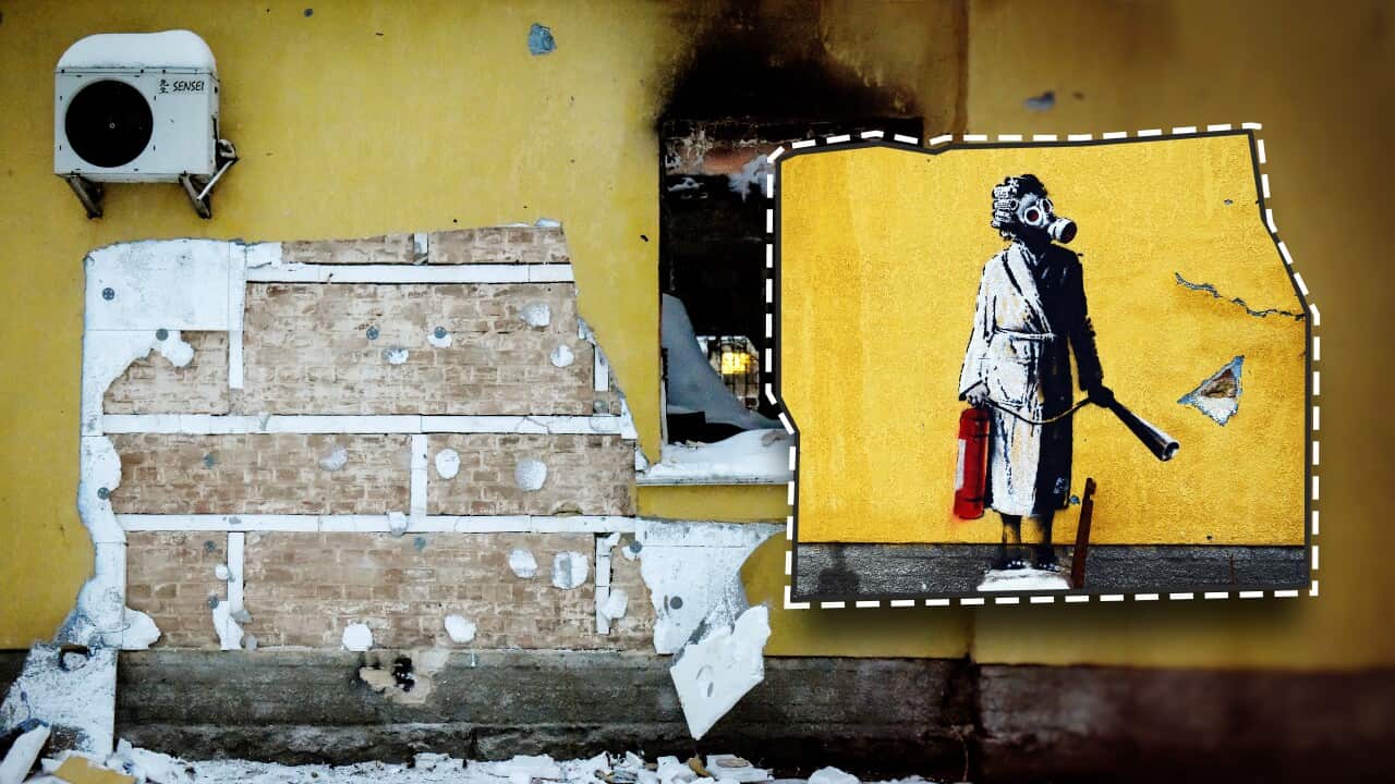 Plaster bearing a mural is pictured ripped from a brick wall in Ukraine