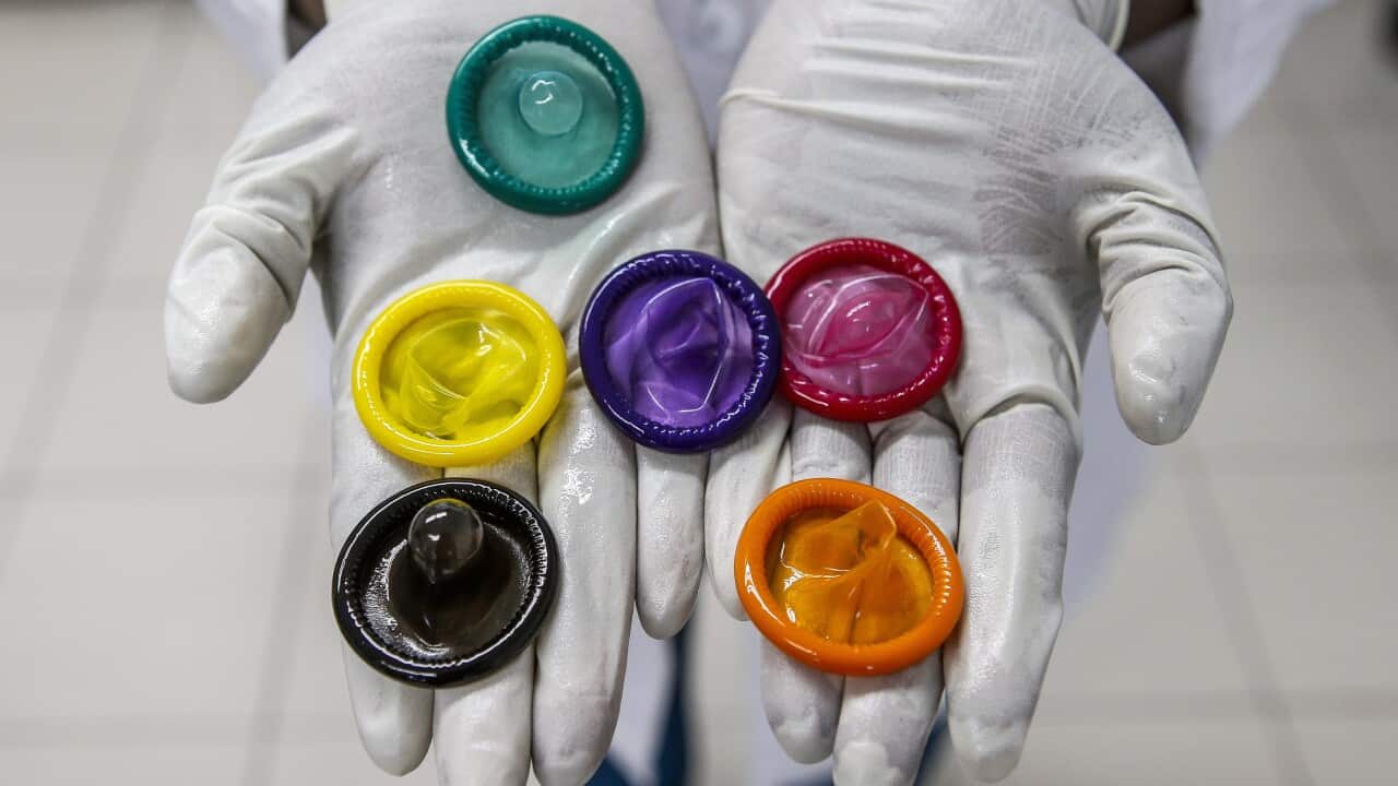 A variety of coloured condoms.