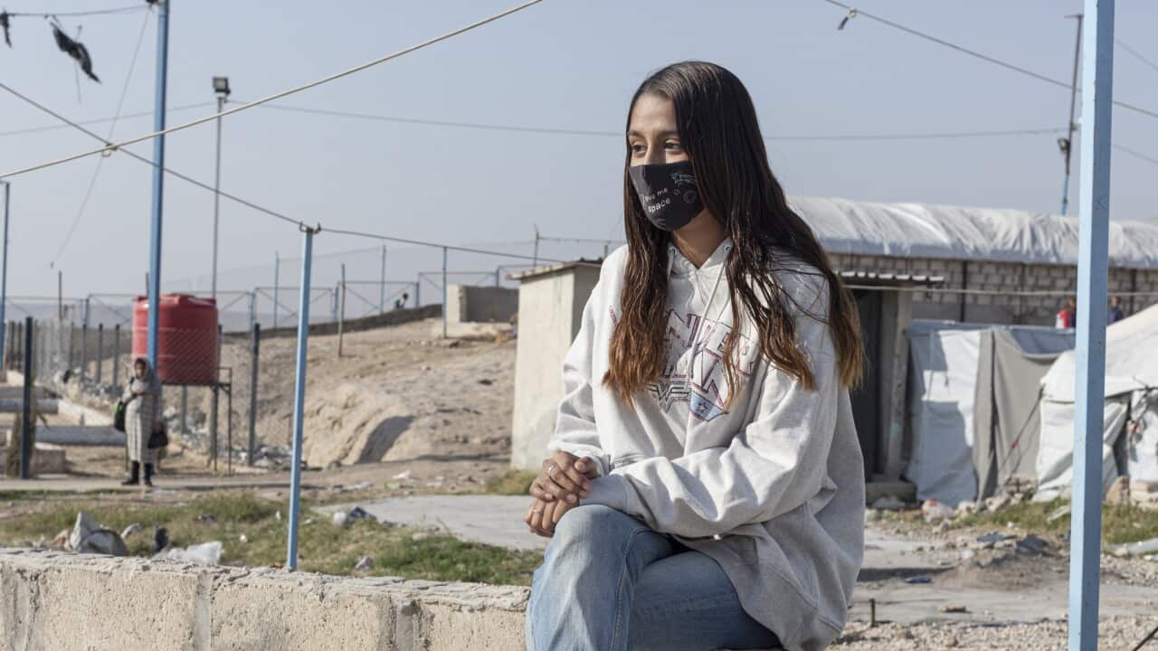 Shamima Begum sitting at Roj Camp in Syria.